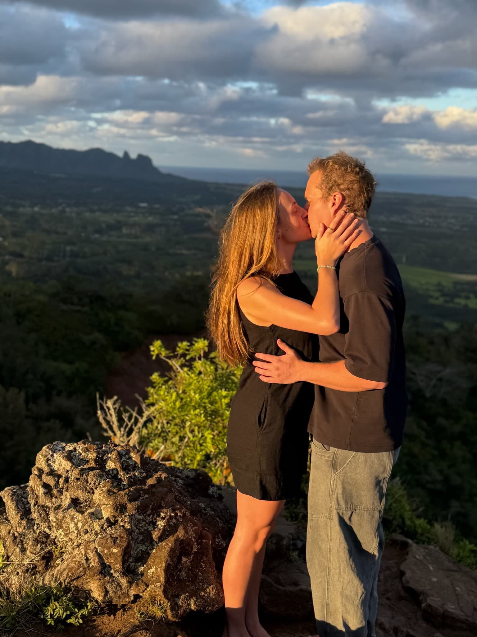 Golden hour kiss on the mountain